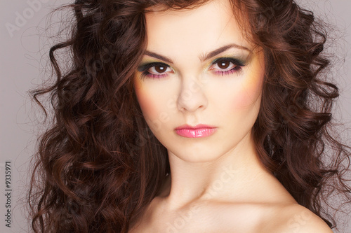 Portrait of sexy woman with beautiful make-up and curly hair