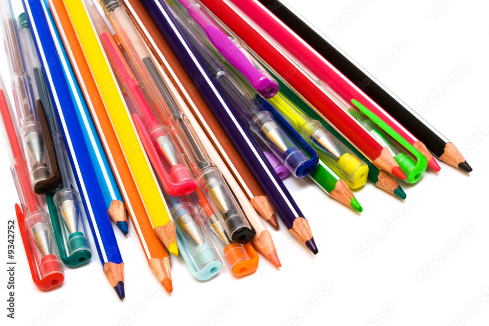 Fototapeta premium Color pencils and pens on a white background