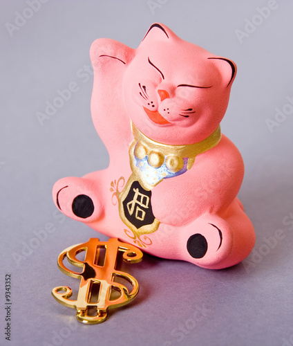 maneki neko cat with golden dollar sign photo