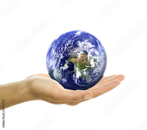 Fototapeta Naklejka Na Ścianę i Meble -  planet earth lying in girl's hands