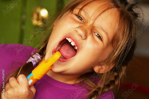 Happy little girl singing very emotionaly