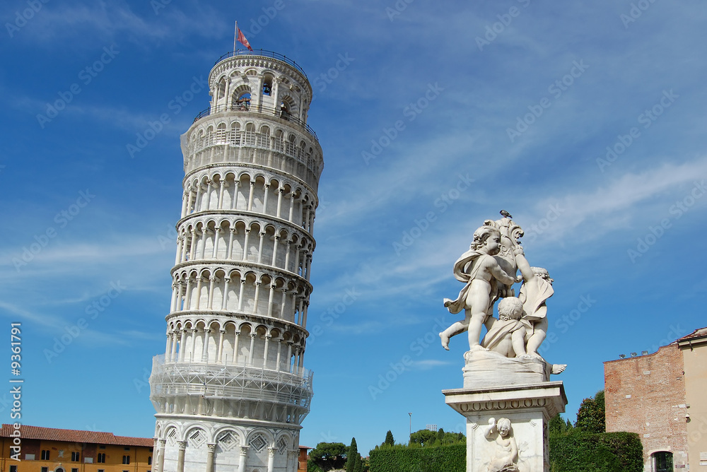The famous leaning tower and Sculpture of angels in Pisa