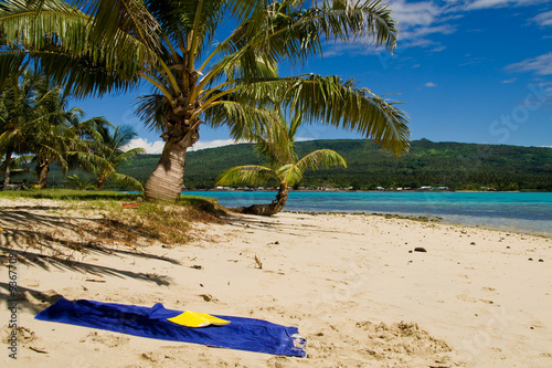 blue towel on the white samoan sand