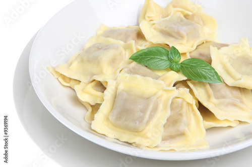 Simple ravioli pasta dish on white background