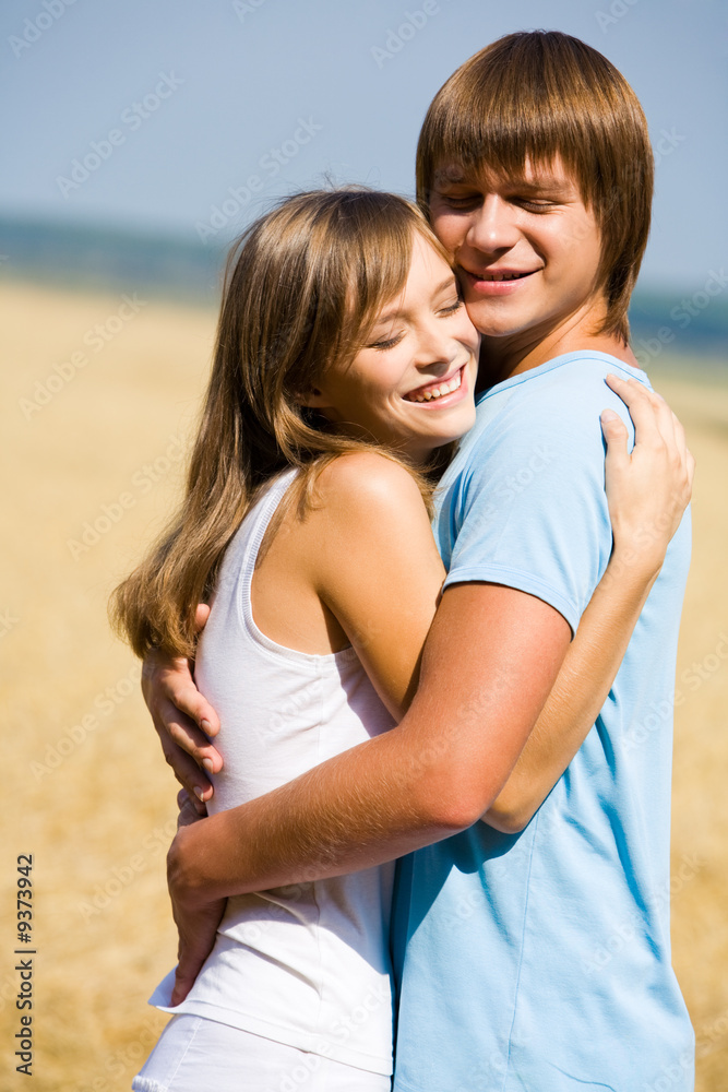 Portrait of girlfriend and boyfriend hugging each other Portrait of girlfriend and boyfriend hugging each other