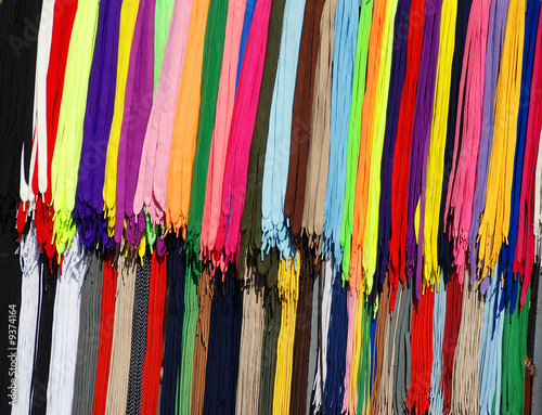 multicolored new laces hanging in row