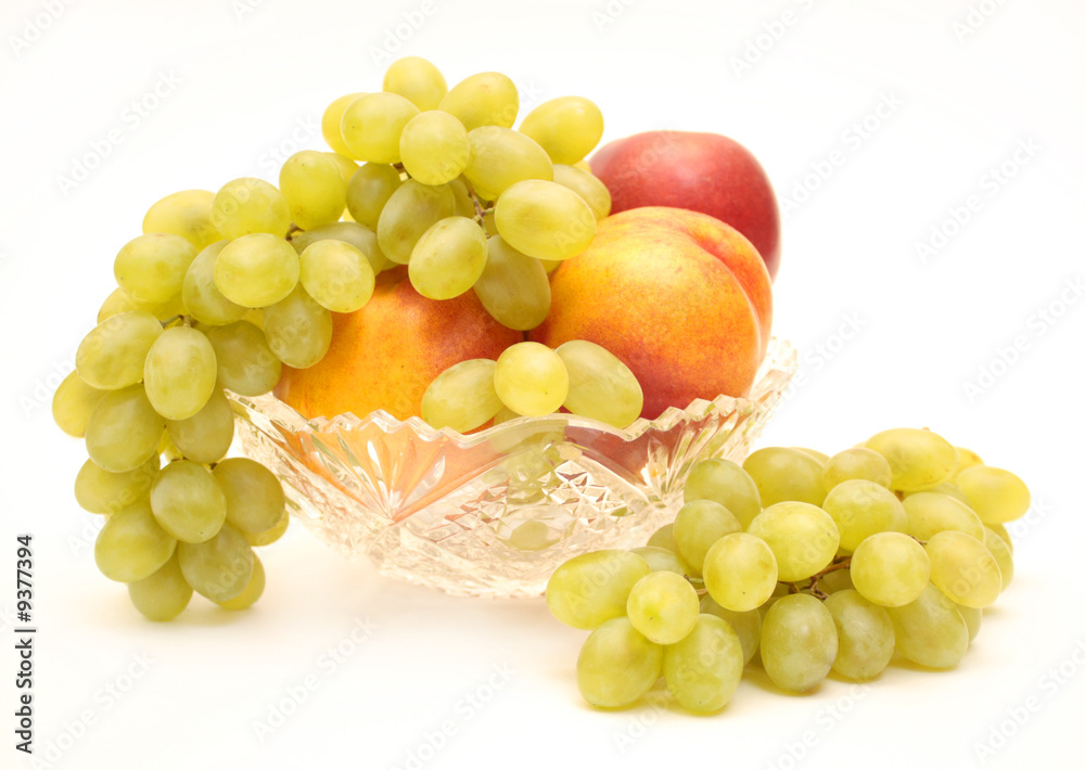 Bright, ripe fruit - grapes and nectarines. Object over white
