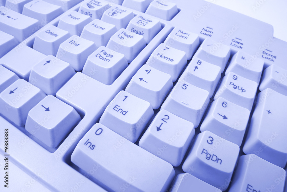 Close Up of Computer Keyboard in Blue Tone Close Up of Computer Keyboard in Blue Tone