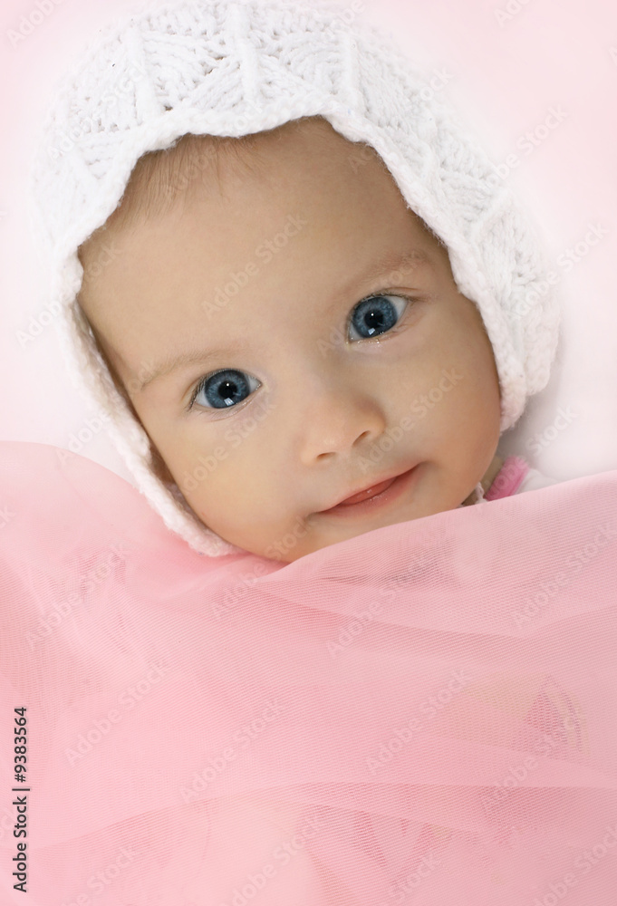 Portrait of the little girl in a knitted hat Portrait of the little girl in a knitted hat