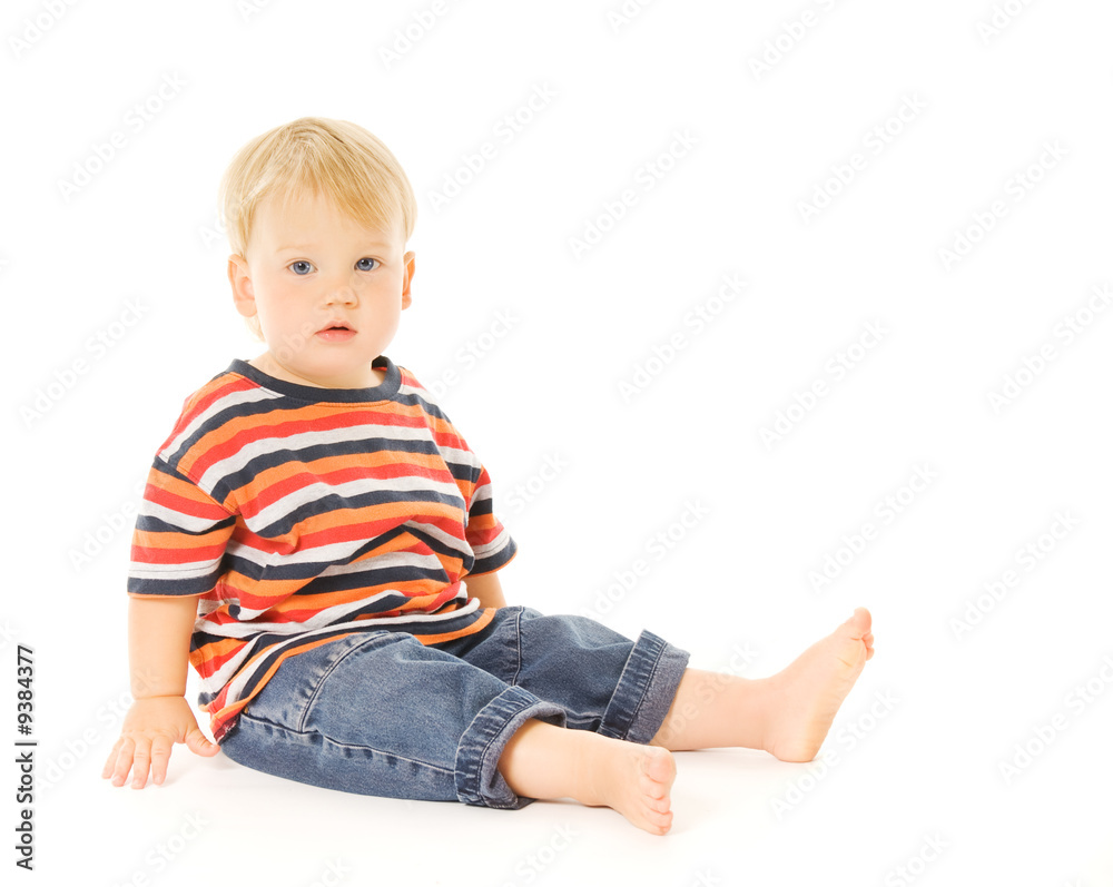 Beautiful child sitiing. Isolated on white background Beautiful child sitiing. Isolated on white background