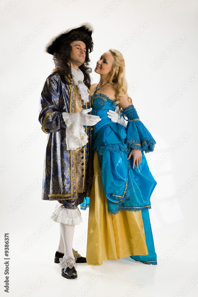 Young woman and man in carnival suits