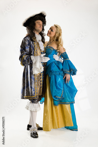 Young woman and man in carnival suits