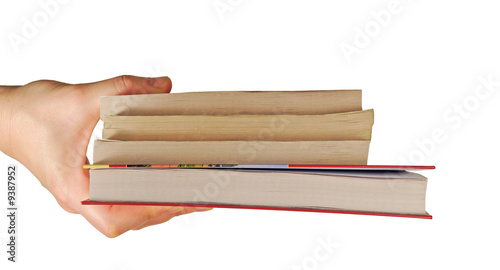 a womanish hand holds different books on a white background
