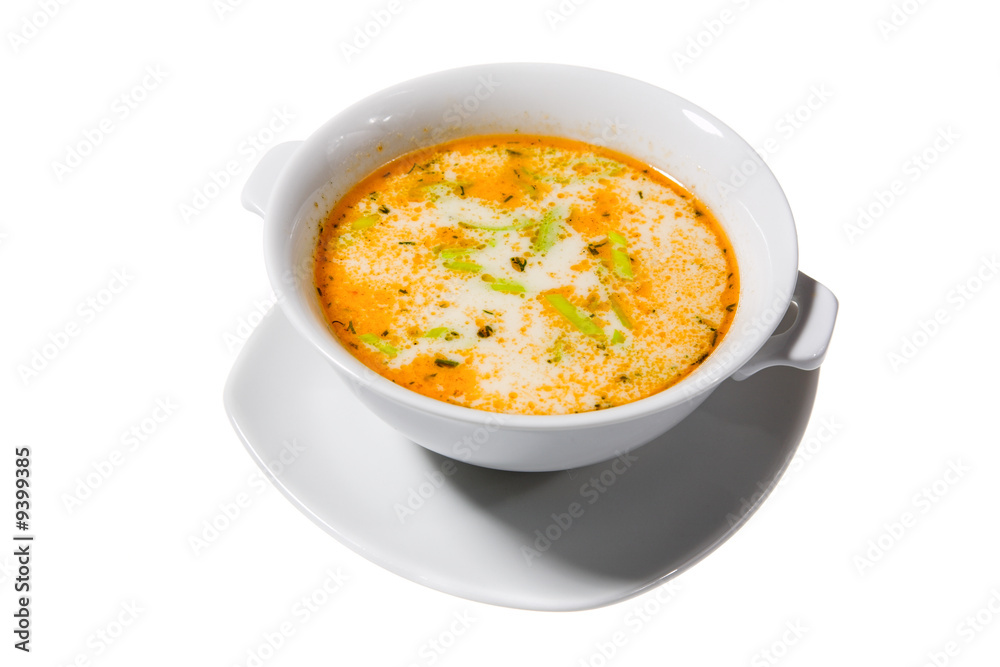soup with green spice in white bowl