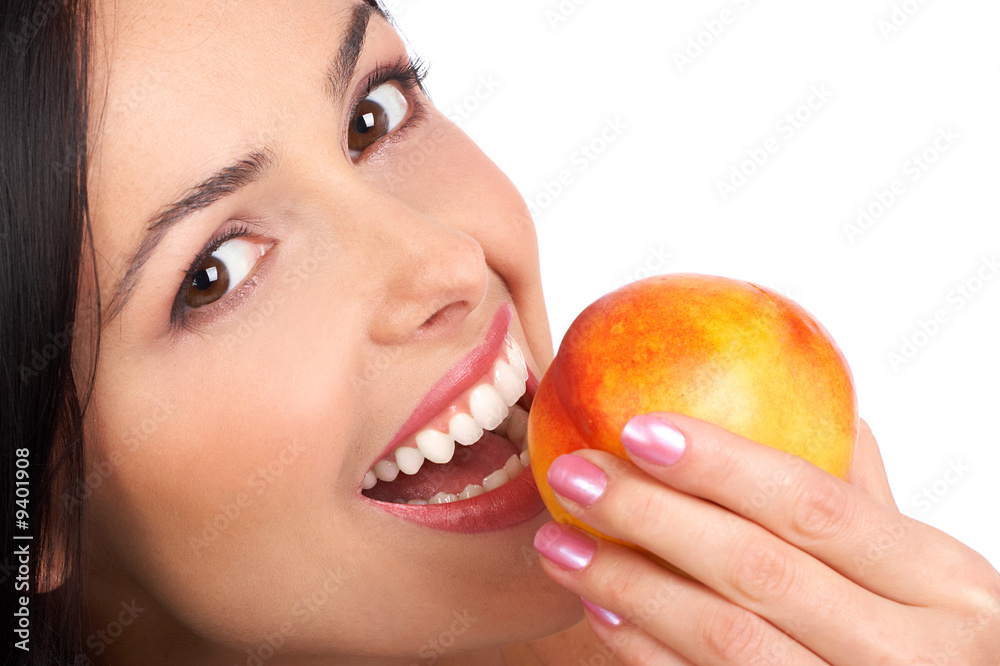 Beautiful young woman eating a peach. Isolated over white. Beautiful young woman eating a peach. Isolated over white.