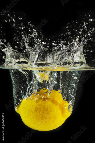 Splashing lemon into a water