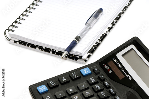 Notebook and calculator isolated on a white background