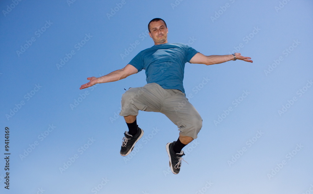 Young man jumping in the air Young man jumping in the air