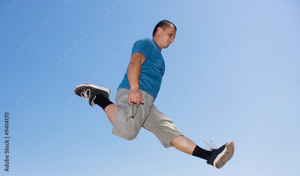 Young man jumping in the air Young man jumping in the air