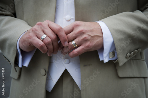 Groom showing  his wedding ring
