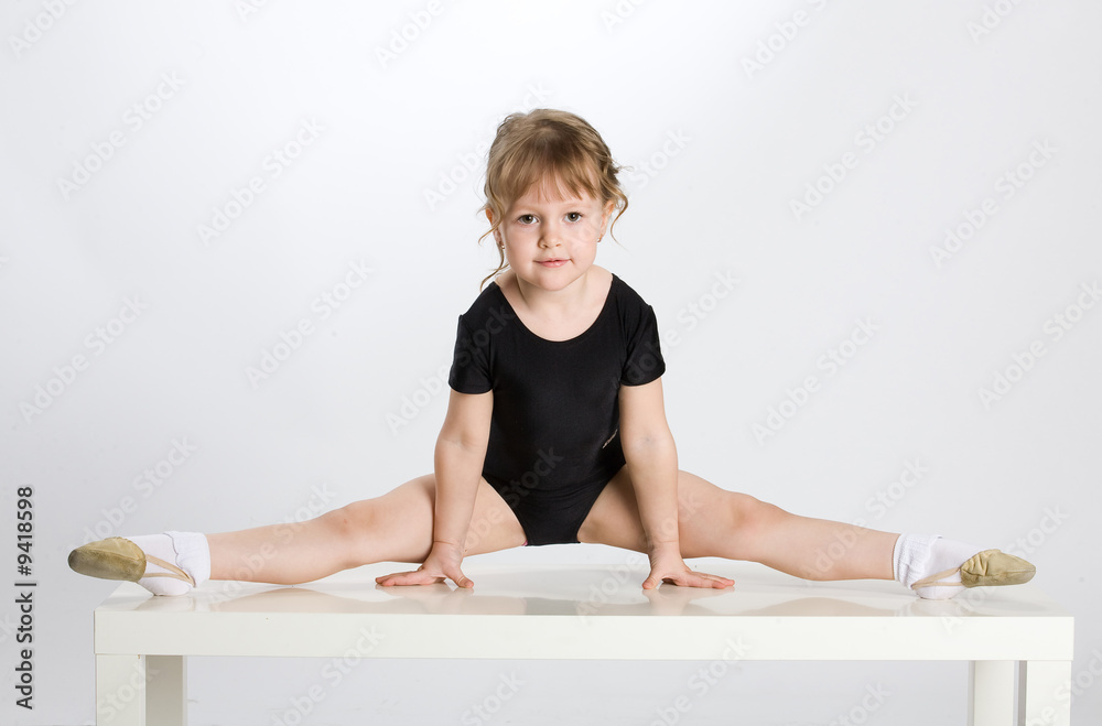Little girl making sport exercises