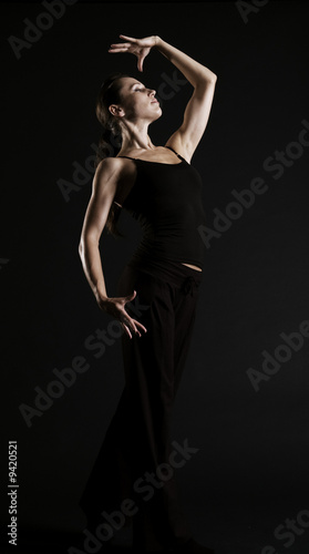 elegant dancer over dark background