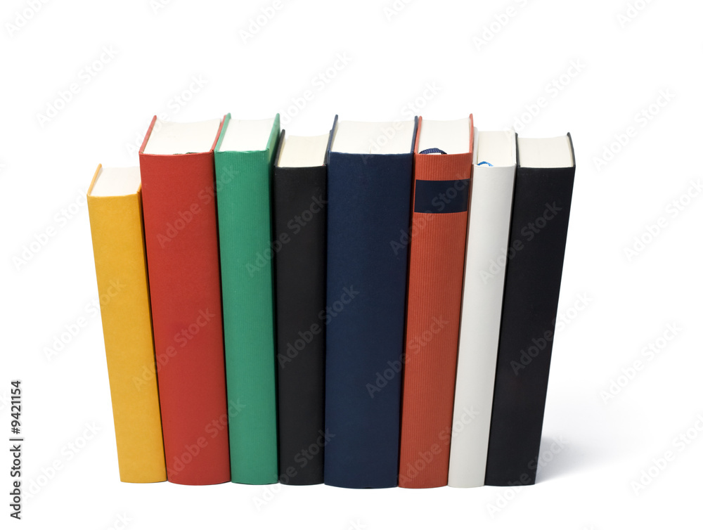 eight books in a row, skewed perspective from top backside eight books in a row, skewed perspective from top backside