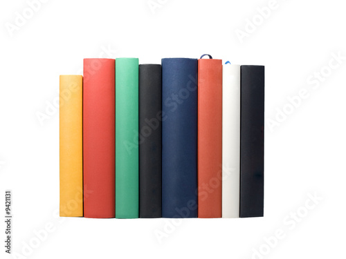 backs of eight books in various colors and sizes, isolated