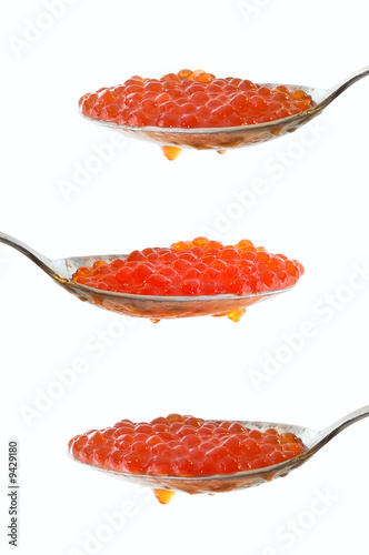 Caviar at spoon on white ba...