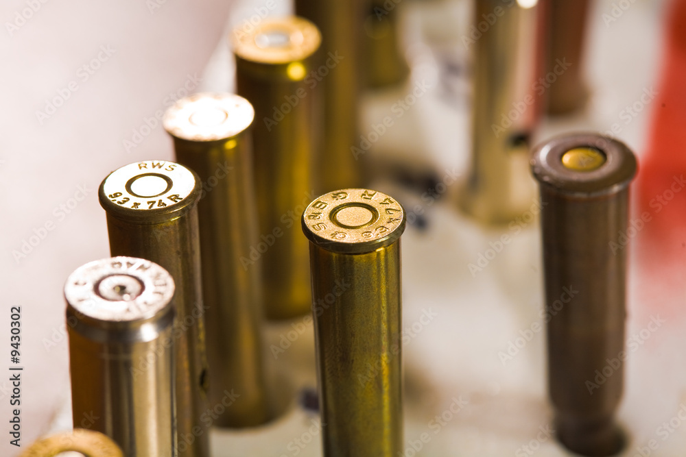 Close up of military ammunition: shell and bullet Close up of military ammunition: shell and bullet