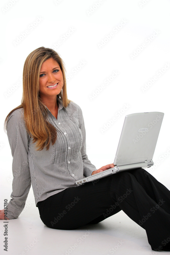 Naklejka premium Happy young woman working on the computer