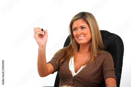 Happy young woman writing w...