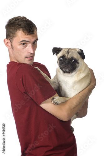 man holding scared pug dog