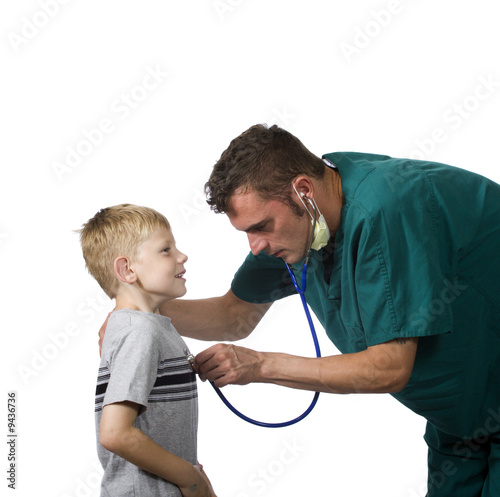 doctor examining young child