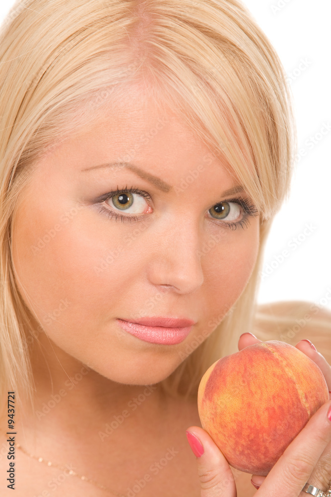 woman with peach isolated on a white background woman with peach isolated on a white background
