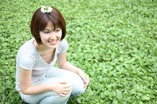 young woman put a small wreath on the head photo