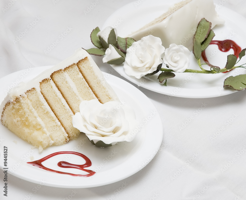 two pieces of a wedding cake on different plates