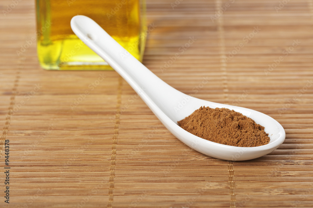 Cinnamon and oil with soft shadow in background. Shallow DOF Cinnamon and oil with soft shadow in background. Shallow DOF