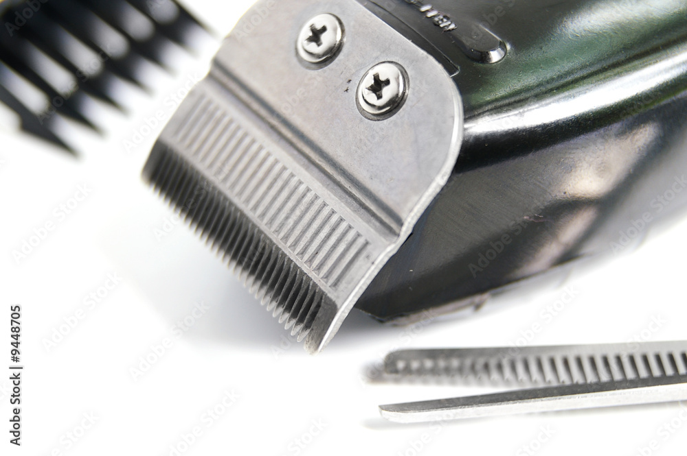 closeup of hair clippers and accessories, on white closeup of hair clippers and accessories, on white
