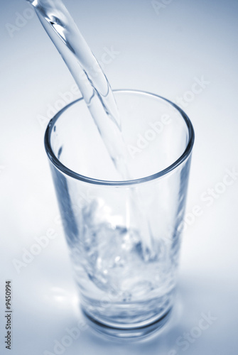 Glass of water being filled up quickly