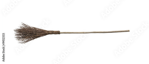 Witch broomstick isolated on white background. photo