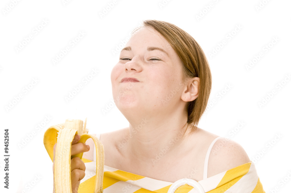 Mädchen beim Essen einer Banane Mädchen beim Essen einer Banane
