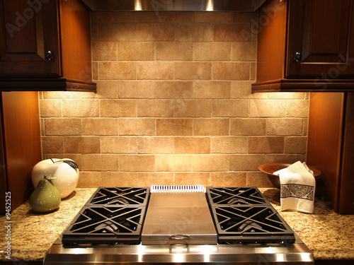 A modern cooktop in a kitchen in an upscale home photo