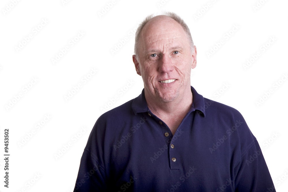 A nice older bald man smiling in a blue shirt A nice older bald man smiling in a blue shirt