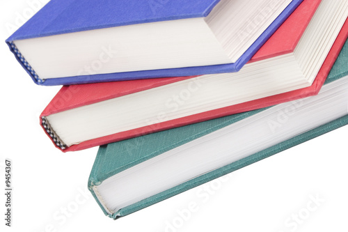 Stacked books on white background