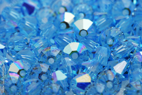 Close up of a pile blue swarovski beads.