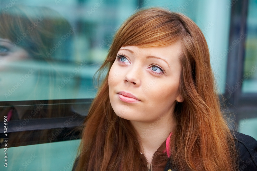 Portrait of teenage girl in outdoor location, looking up Portrait of teenage girl in outdoor location, looking up