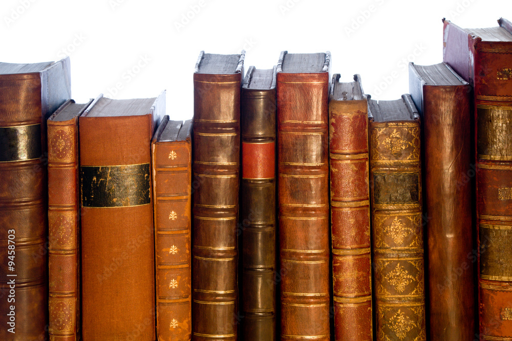 Row of antique leather books isolated on a white background Row of antique leather books isolated on a white background