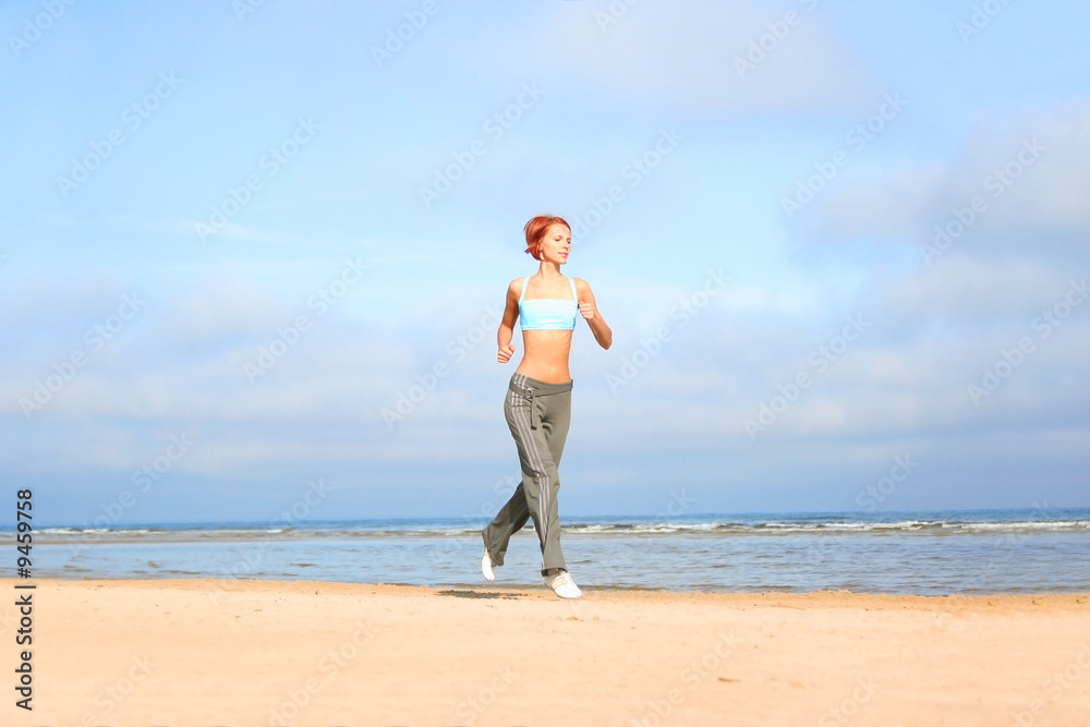 young girl running on the beach