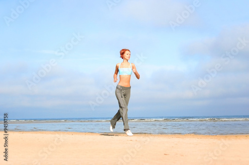 young girl running on the beach